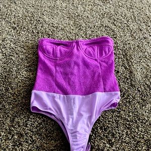 Pretty little thing. Lilac glitter body suit
